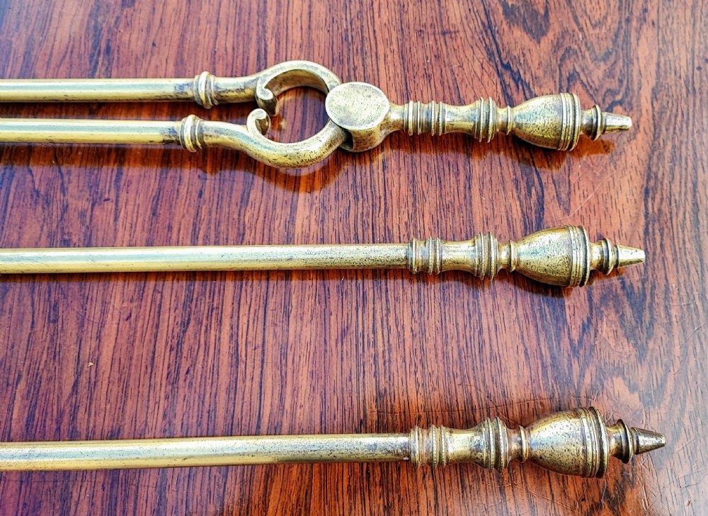 A pretty Georgian set of 3 brass fire irons. View V