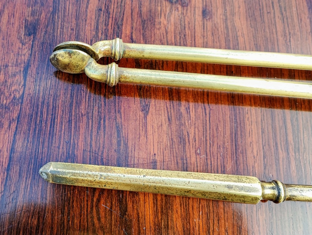 A pretty Georgian set of 3 brass fire irons. View VII
