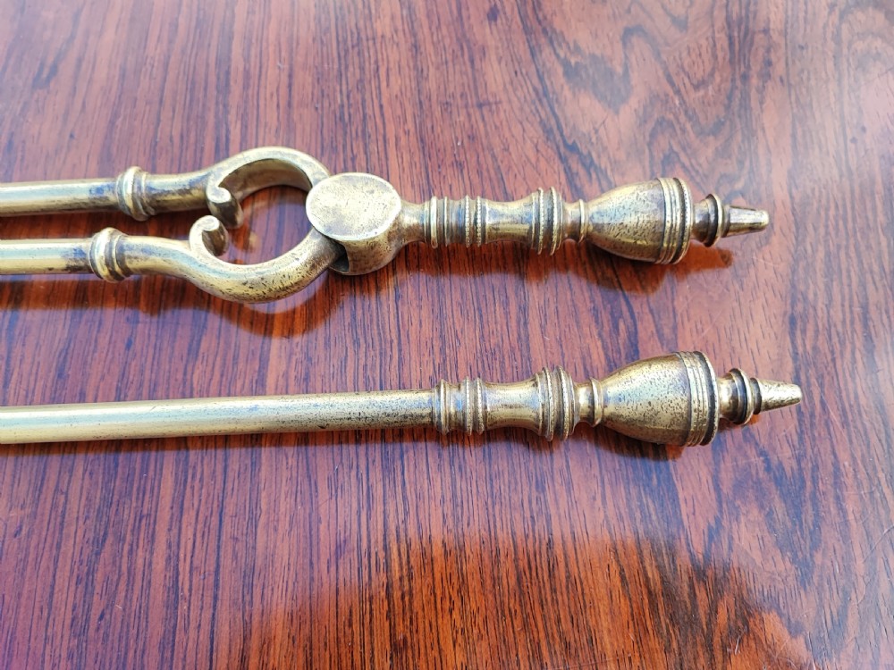 A pretty Georgian set of 3 brass fire irons. View IX