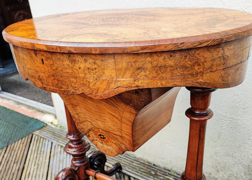 a stunning  victorian burr walnut work or sewing  table View VII