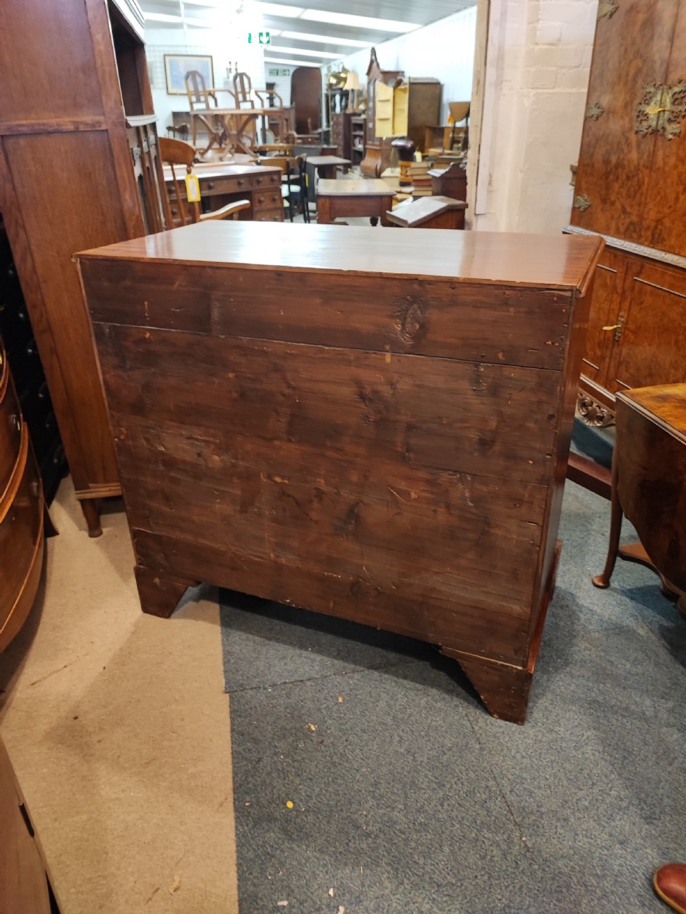 A rare Georgian mahogany chest of drawers,with original handles depicts the profile of King George III. View III