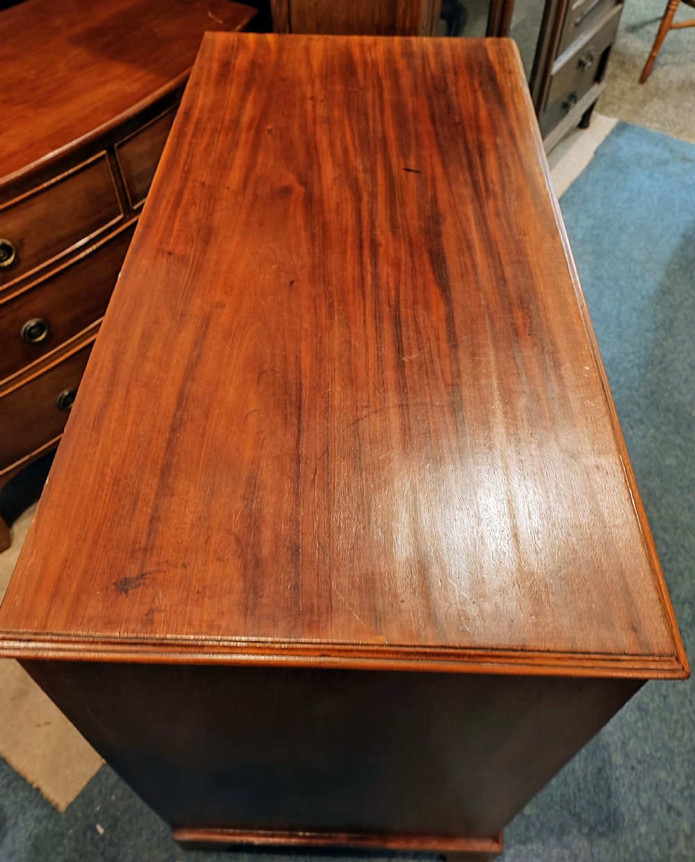 A rare Georgian mahogany chest of drawers,with original handles depicts the profile of King George III. View X