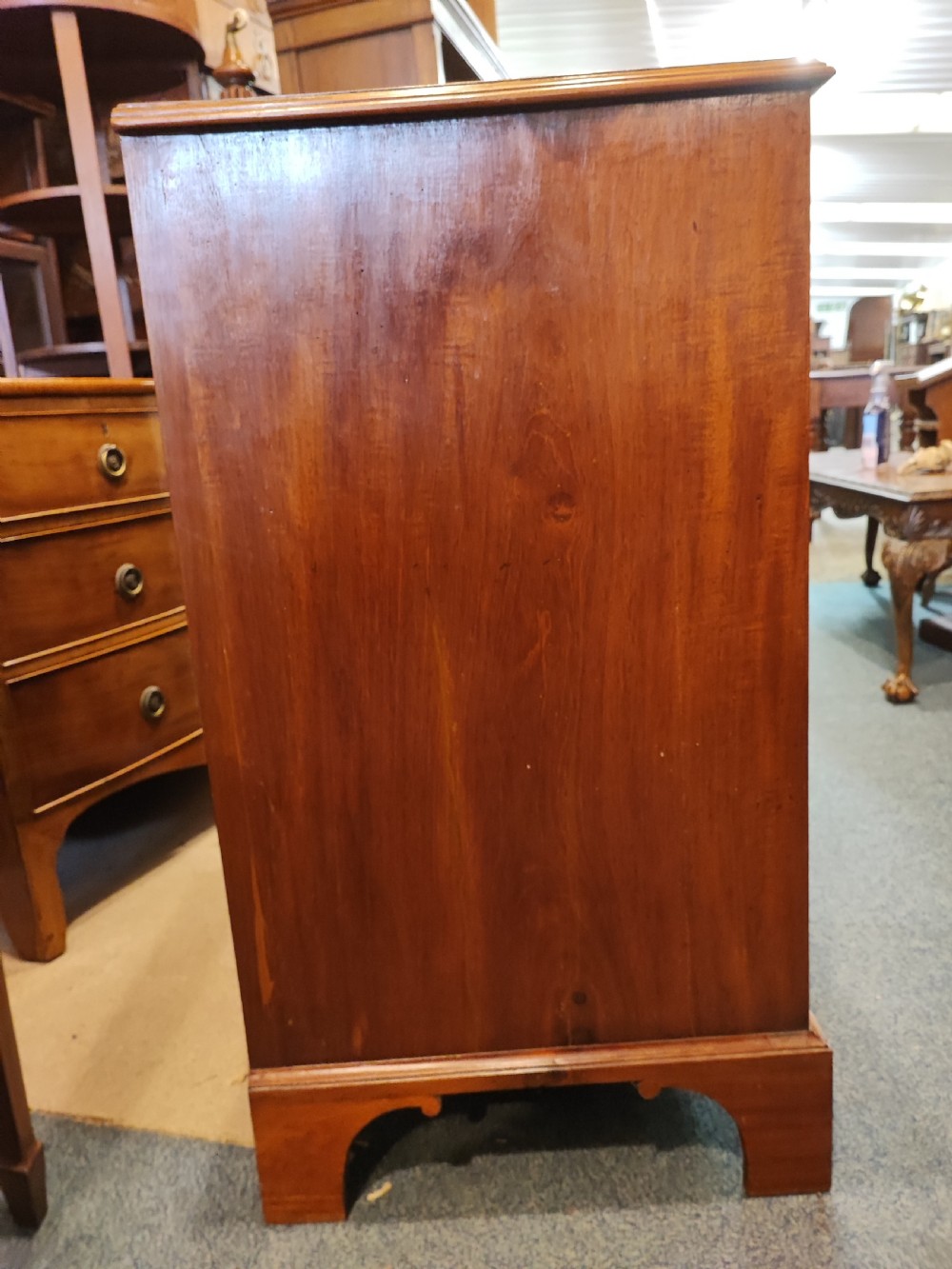 A rare Georgian mahogany chest of drawers,with original handles depicts the profile of King George III. View XIII