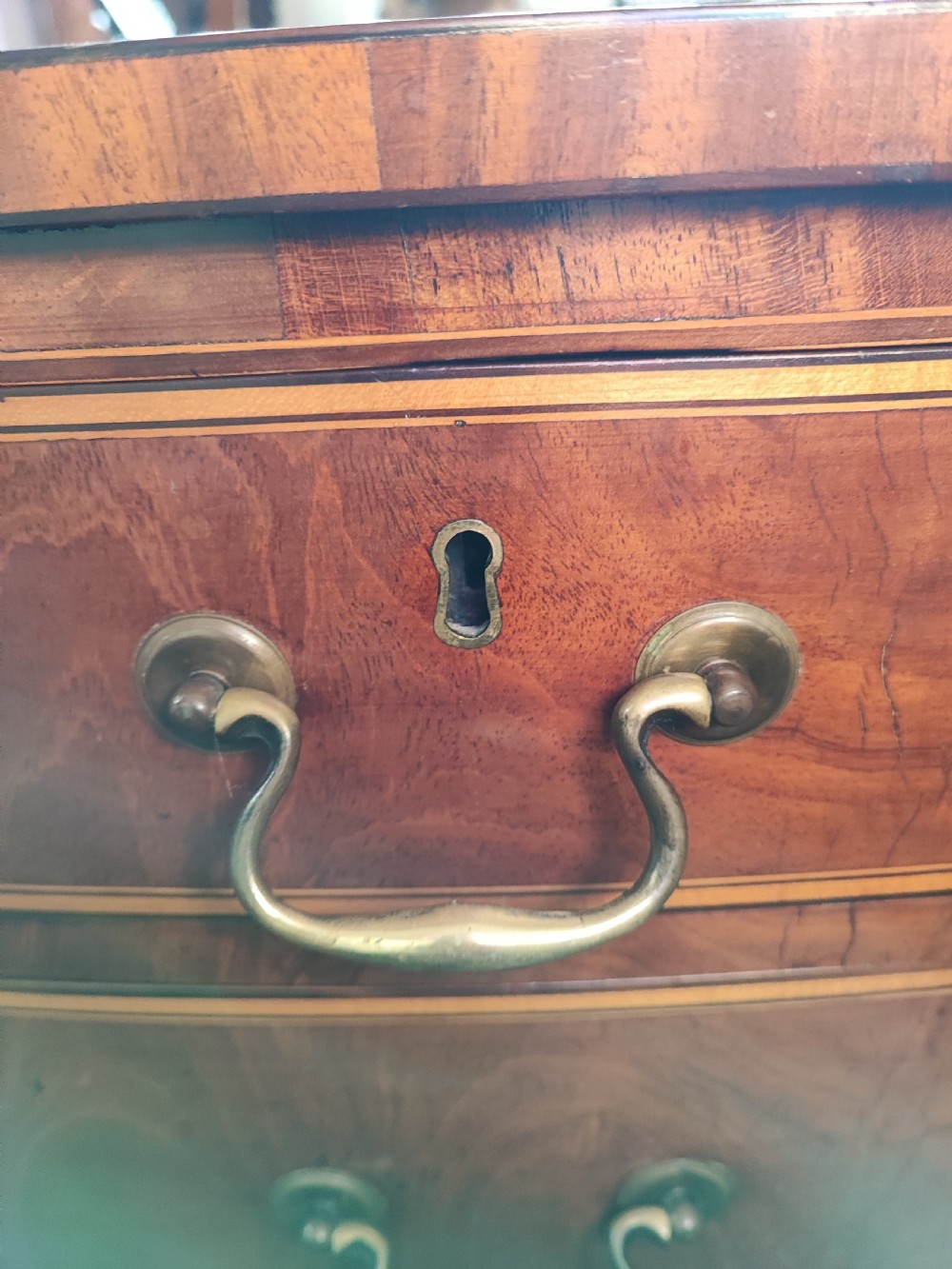 A good Georgian inlaid bow front chest of drawers. View II