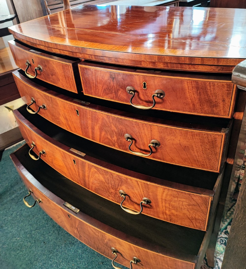 A good Georgian inlaid bow front chest of drawers. View VIII