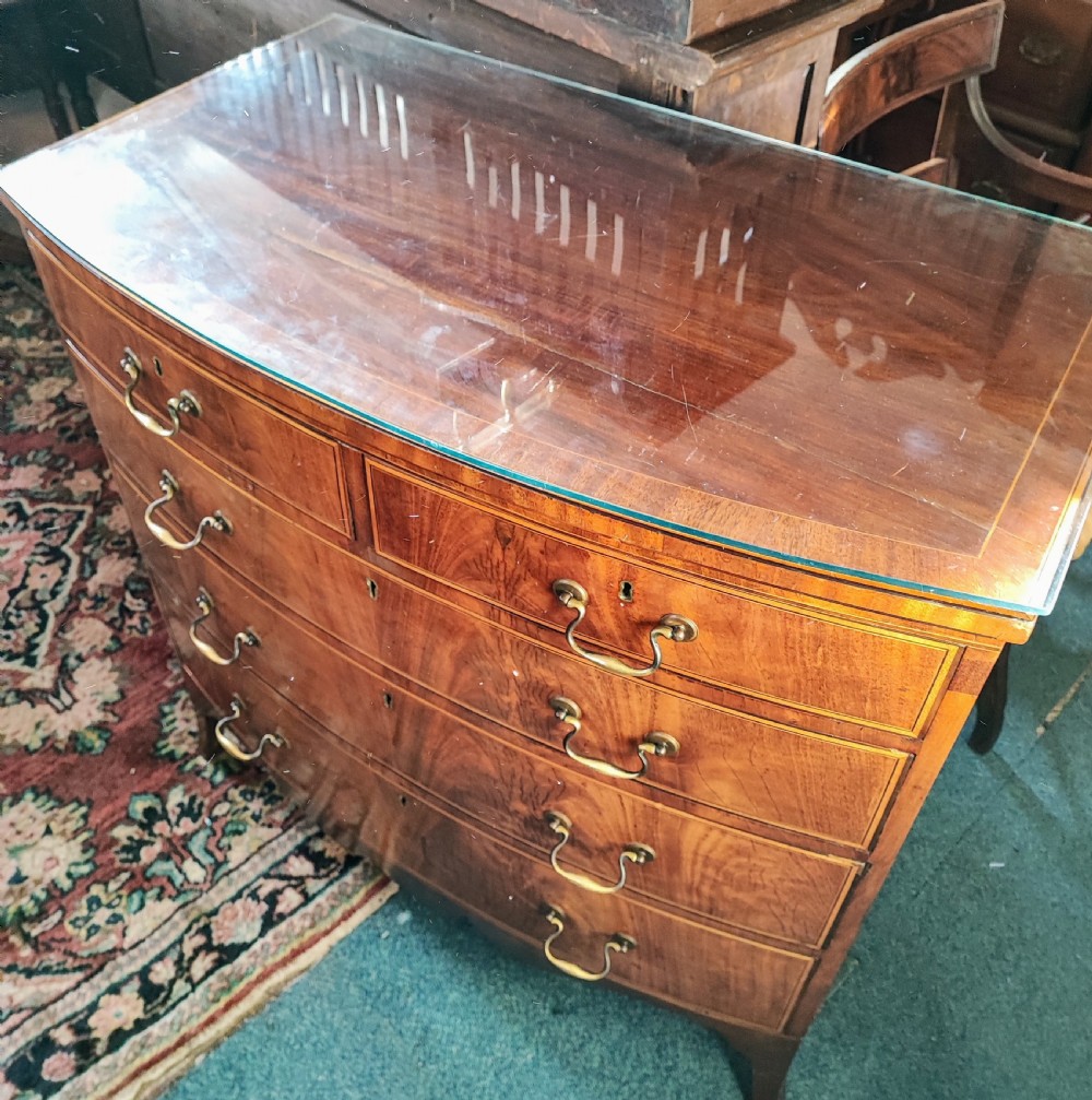 A good Georgian inlaid bow front chest of drawers. View IX
