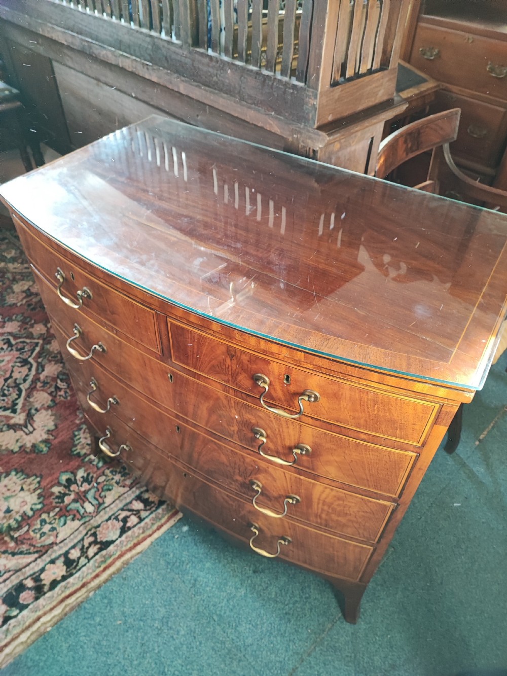 A good Georgian inlaid bow front chest of drawers. View XVI