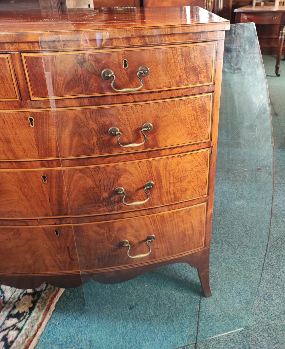 A good Georgian inlaid bow front chest of drawers. View XIX