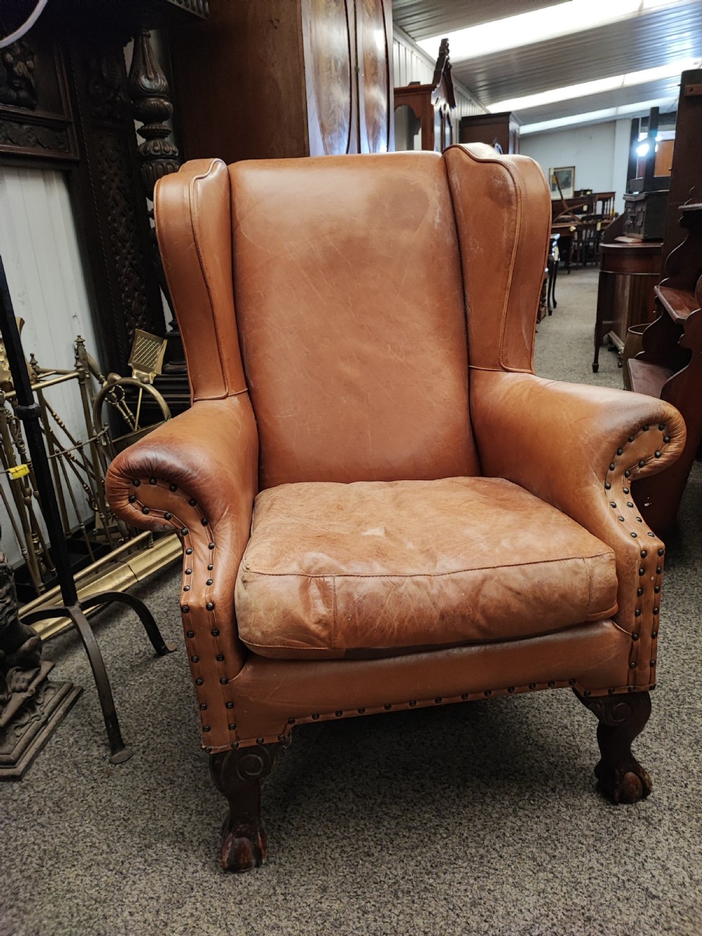 Leather and mahogany wing chair View IX