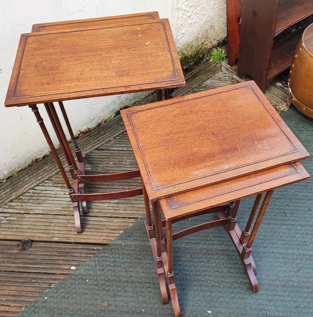 Antique mahogany nest of 4 tables in the George III style. View III