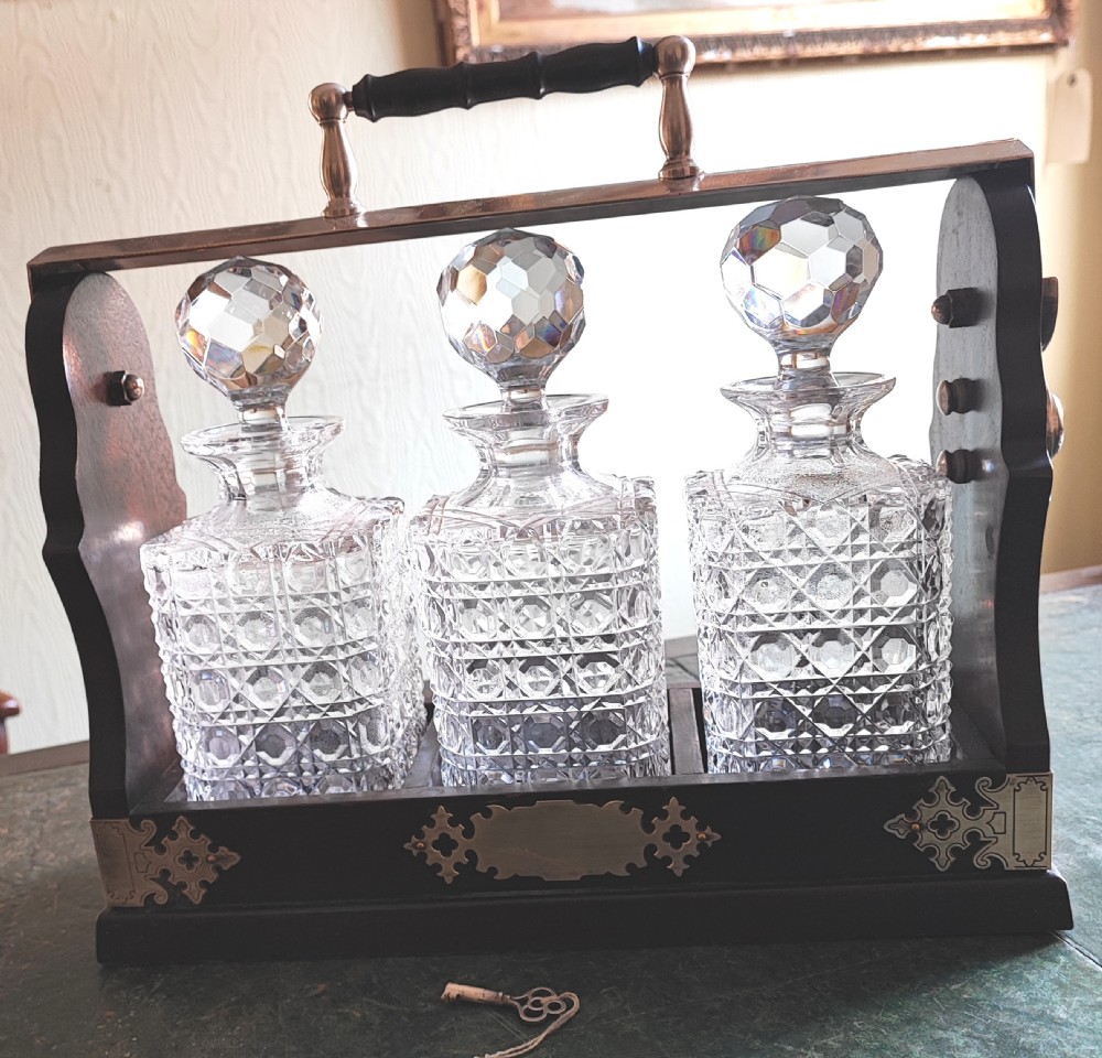 An antique mahogany and cut glass tantalus. View II