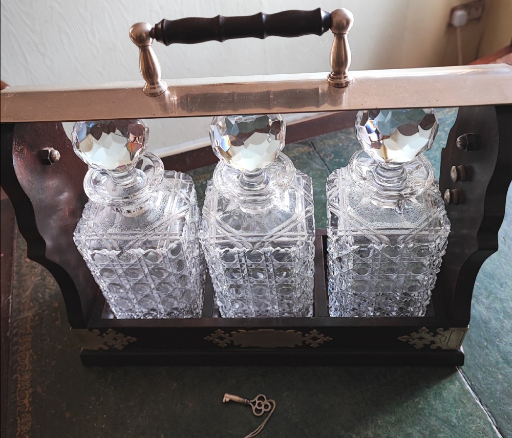 An antique mahogany and cut glass tantalus. View III