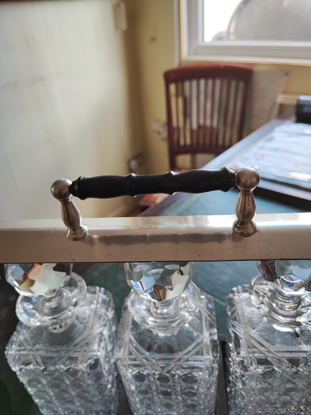 An antique mahogany and cut glass tantalus. View X