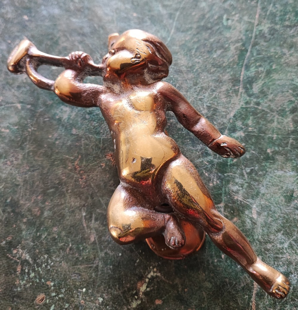 Edwardian cherub brass door knocker.