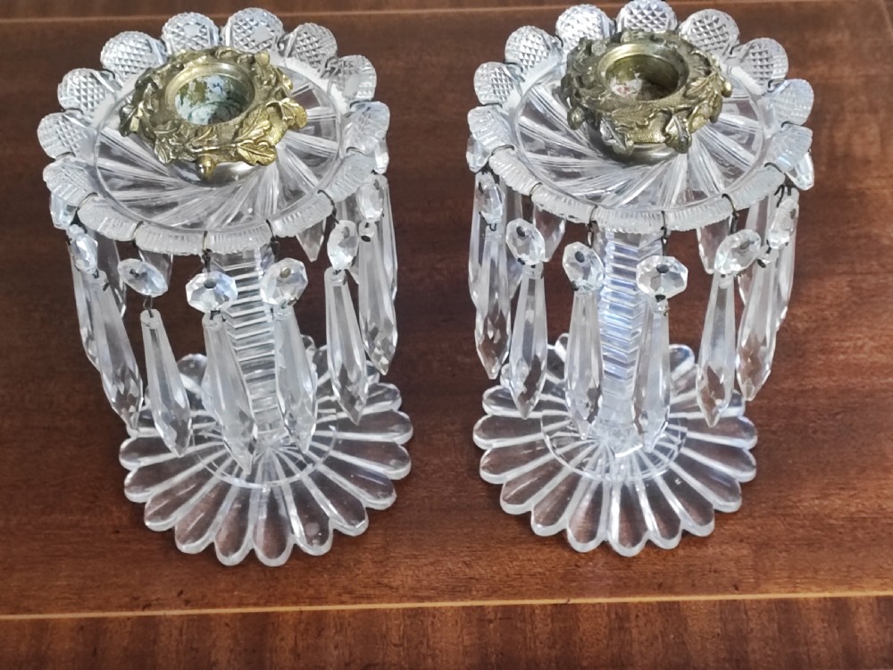 A small pair of Regency cut glass and brass candle lusters
