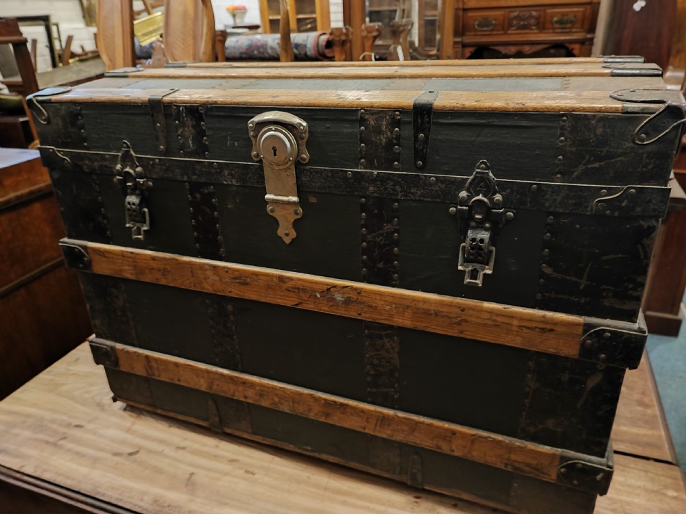 Antique wooden bound travel or steamer trunk.