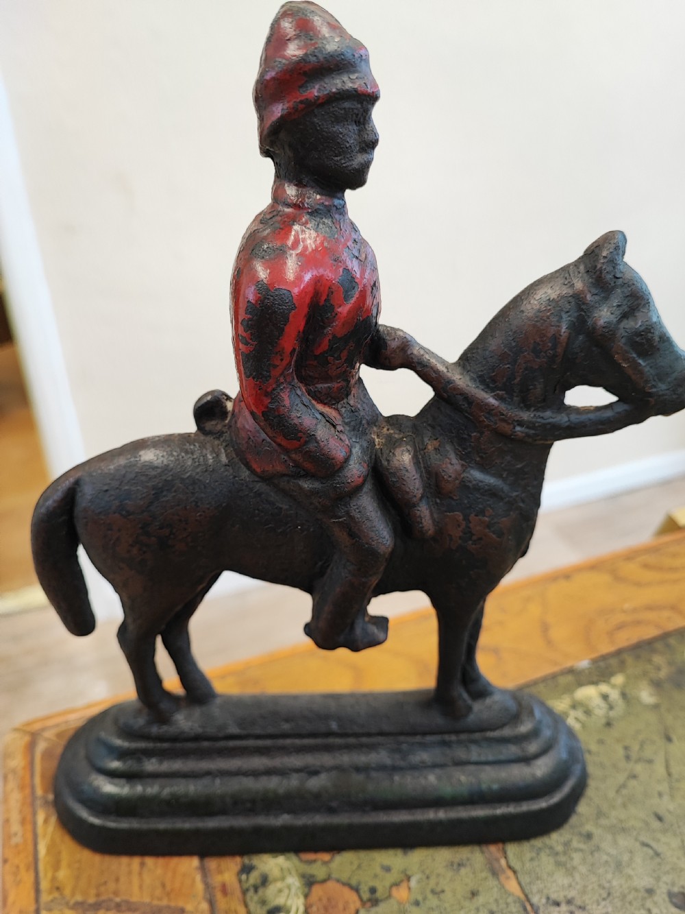 19c cast iron and enamel Boer war soldier on horseback.door stop
