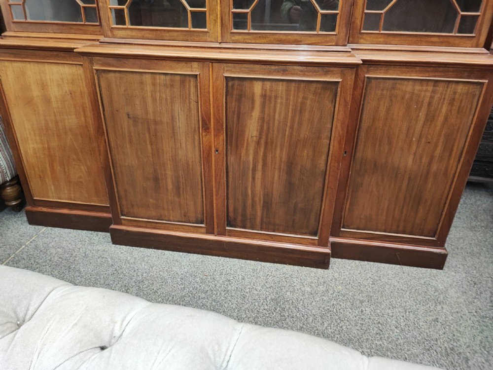 Antique mahogany breakfront bookcase in the George III style. View VI