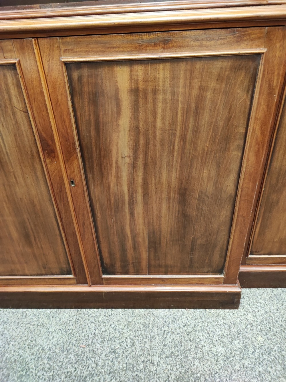 Antique mahogany breakfront bookcase in the George III style. View IX