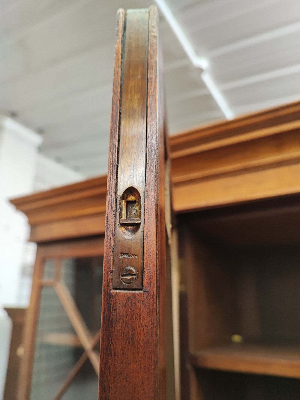 Antique mahogany breakfront bookcase in the George III style. View XIII