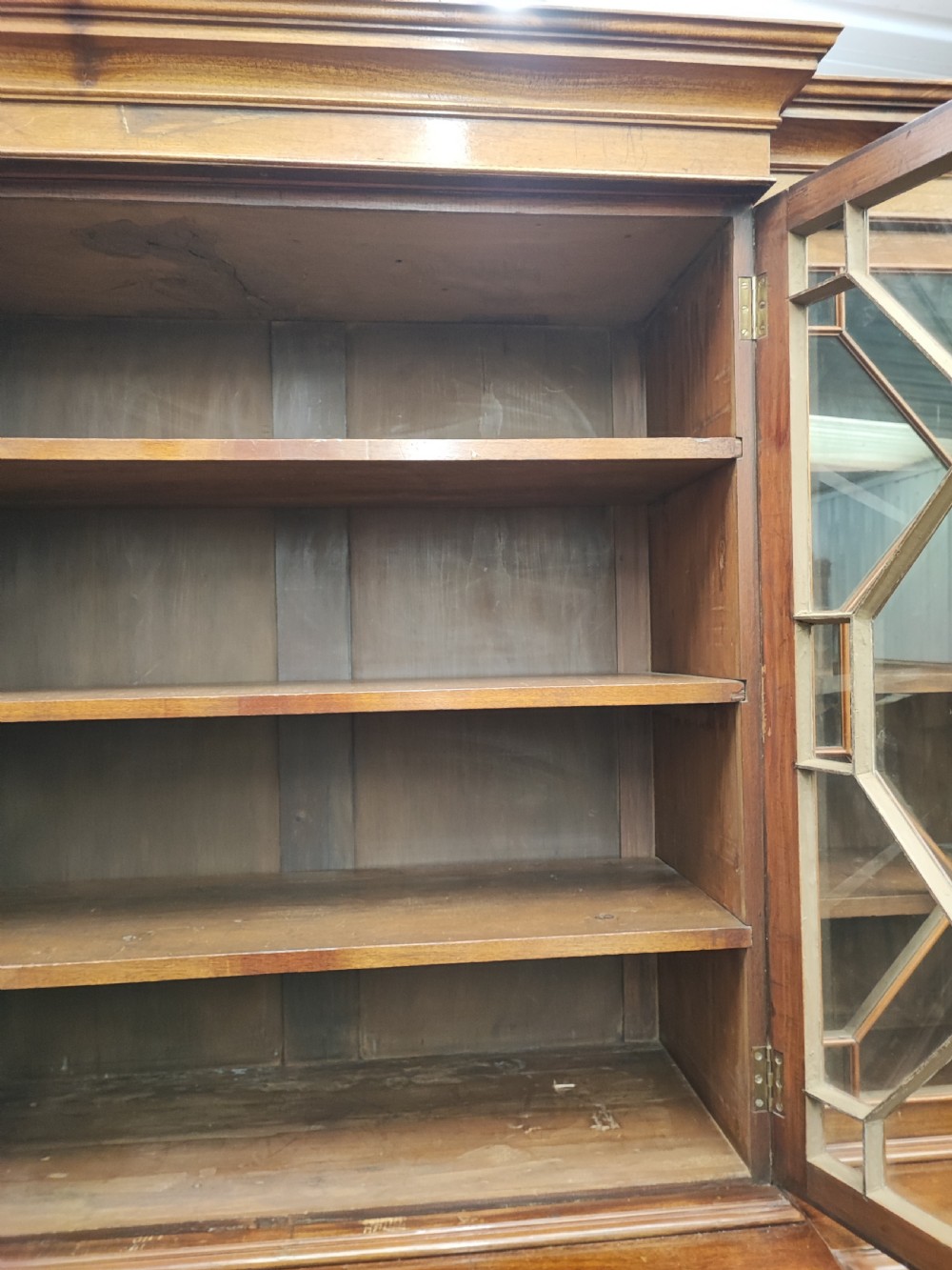 Antique mahogany breakfront bookcase in the George III style. View XIV