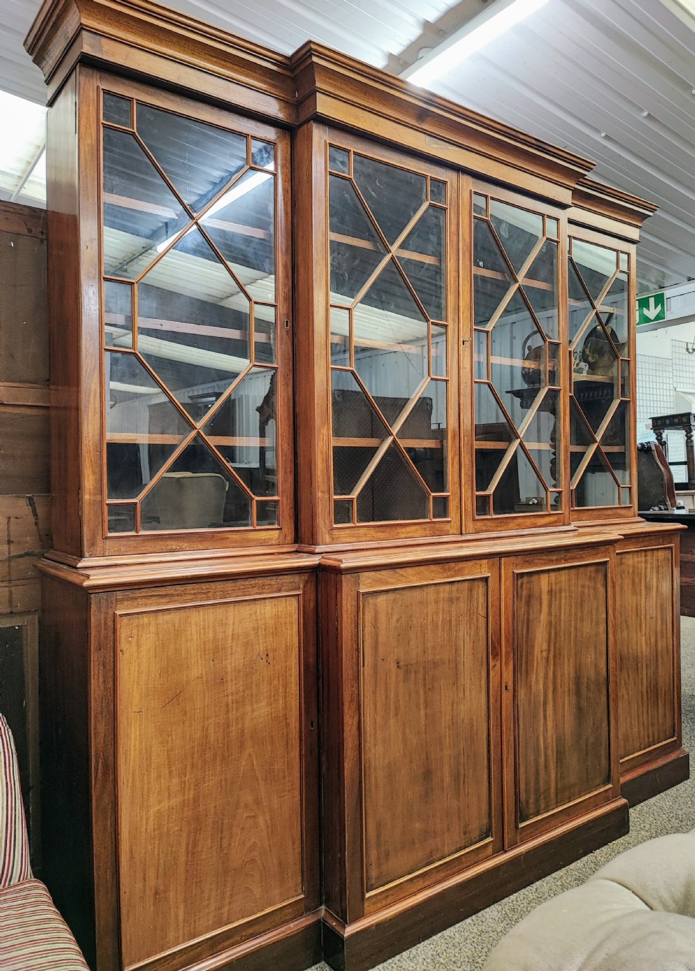 Antique mahogany breakfront bookcase in the George III style. View XVI