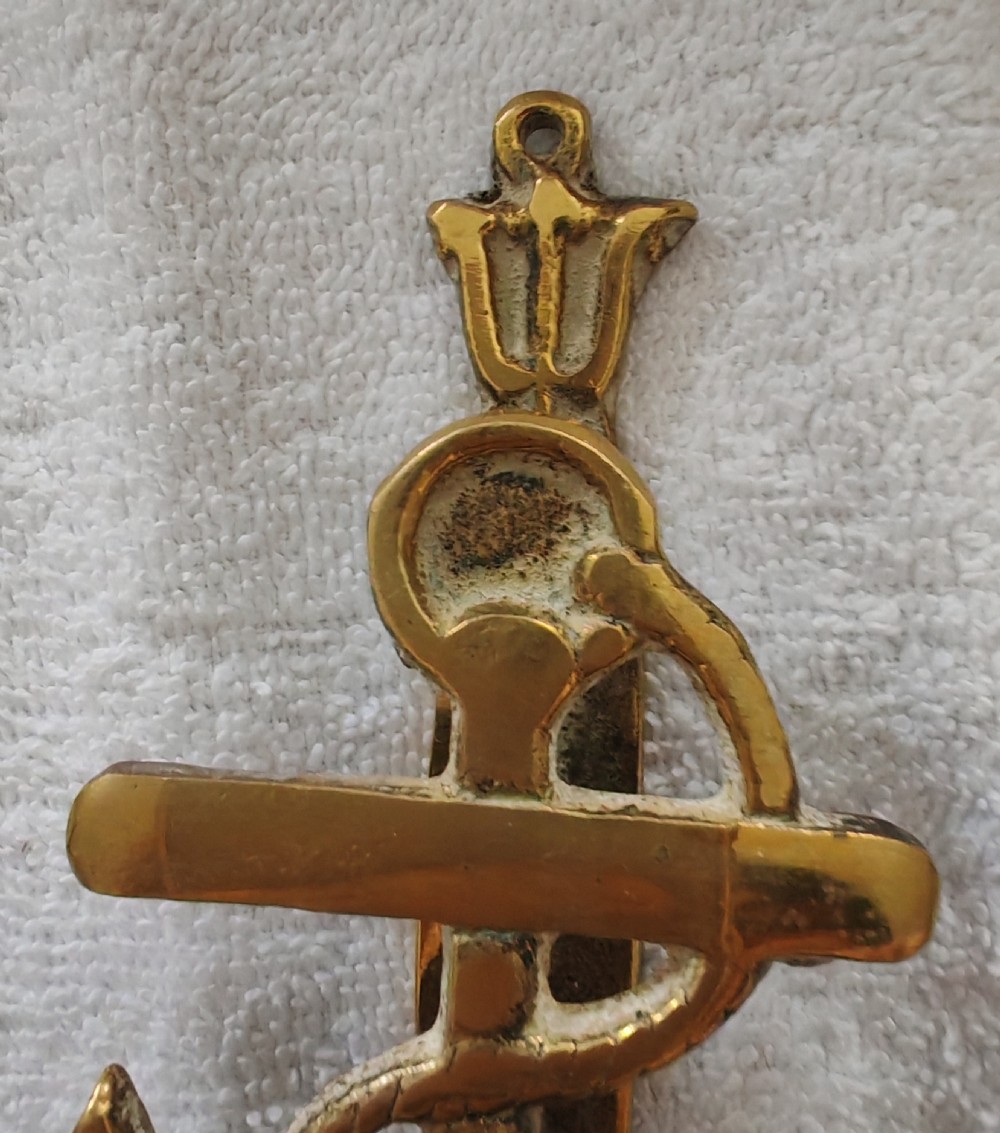 A solid cast brass door knocker crafted in the shape of a fouled anchor with rope detailing and an integrated striker. View VIII