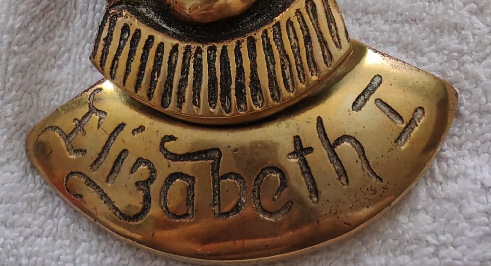 Antique brass door knocker depicting Elizabeth the first. View XIII