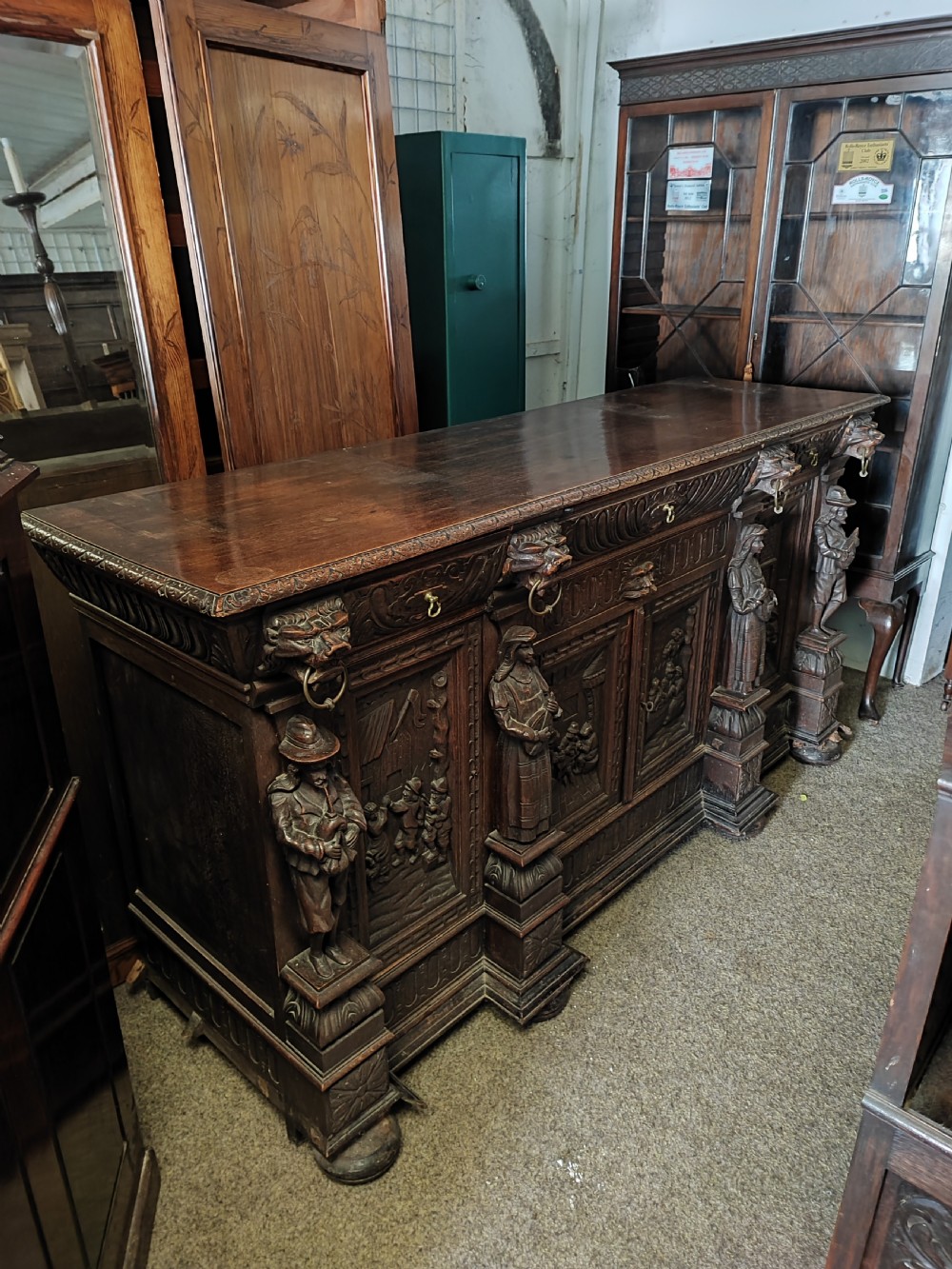 Fabulous carved oak sideboard of large size.