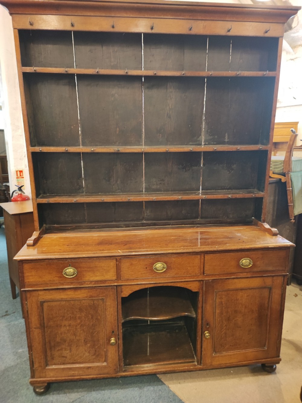 A charming Regency welsh  oak dog kennel dresser.
