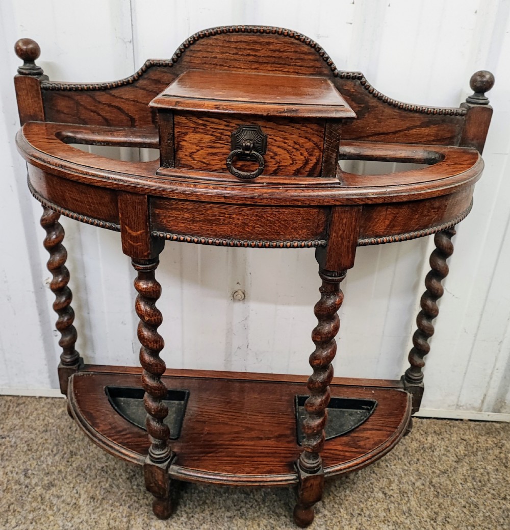 Antique English oak umbrella stick stand.