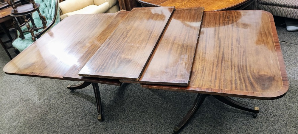 Antique, large, mahogany extending Regency style twin pillar dining table 