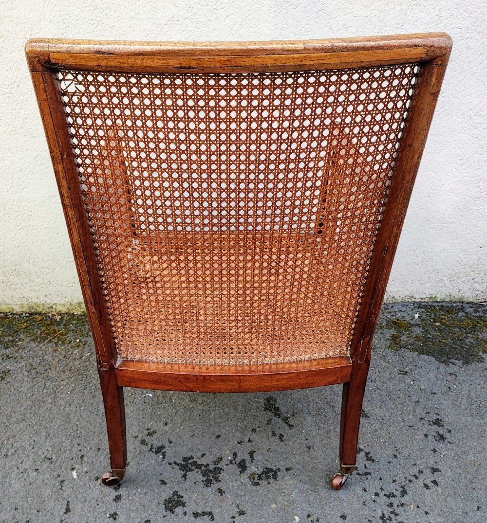 A Regency Gillows mahogany Bergere library arm chair View XIV