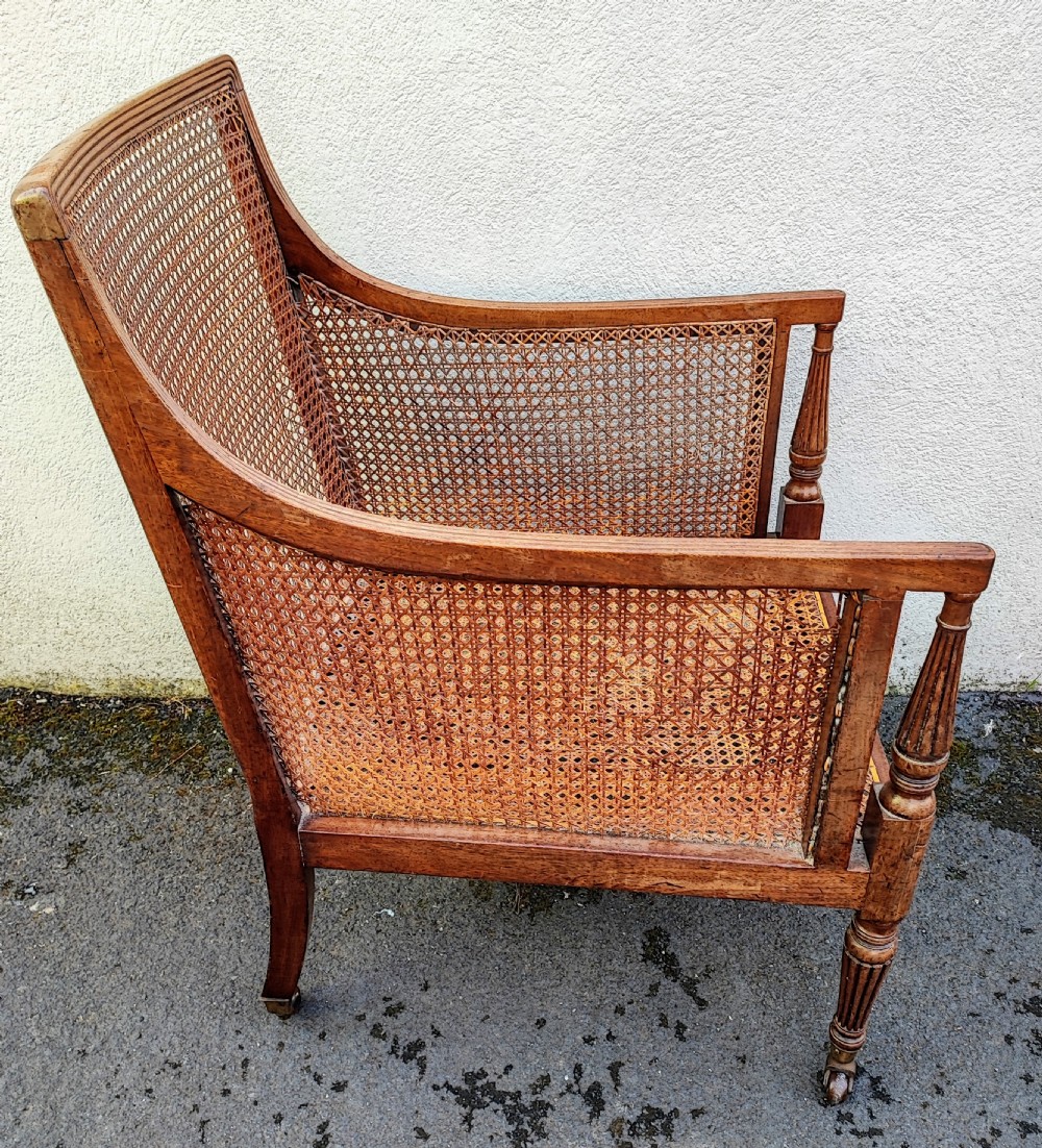 A Regency Gillows mahogany Bergere library arm chair View XV