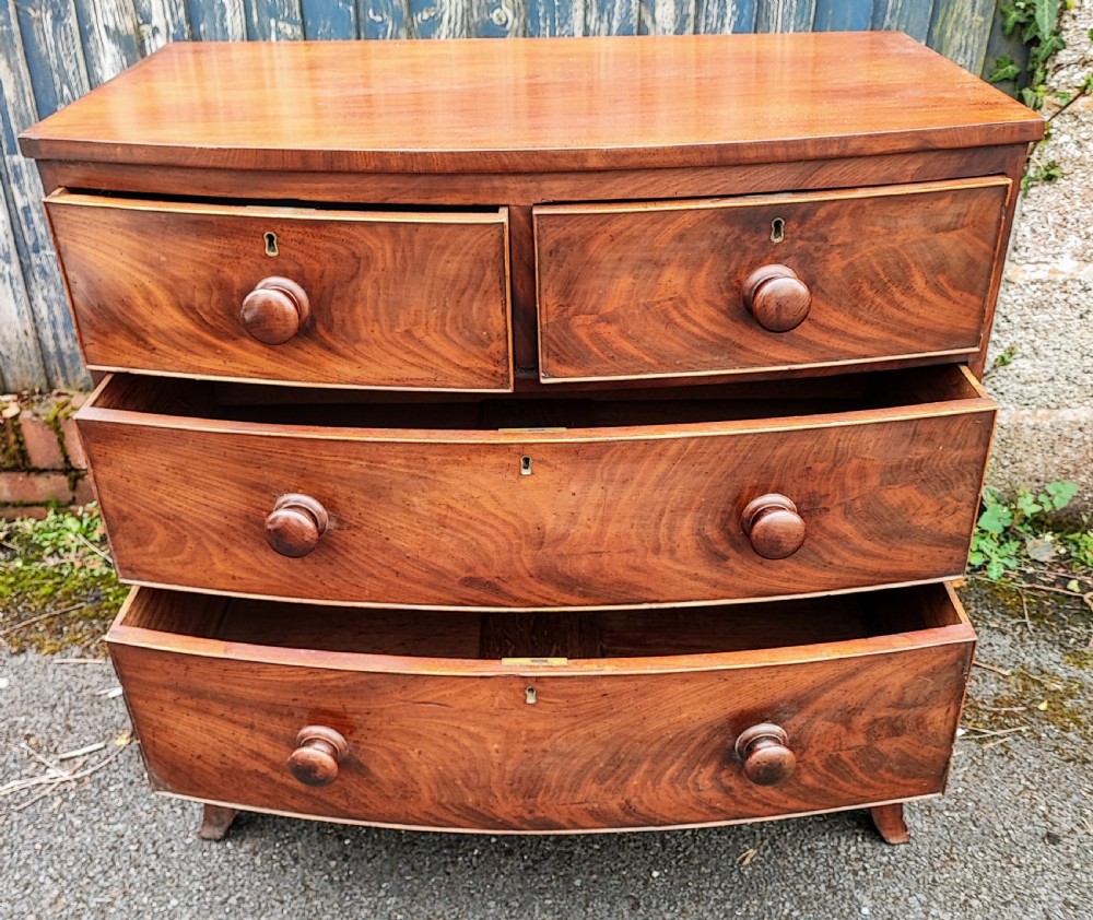 A small Regency mahogany bowfront chest of drawers. View III