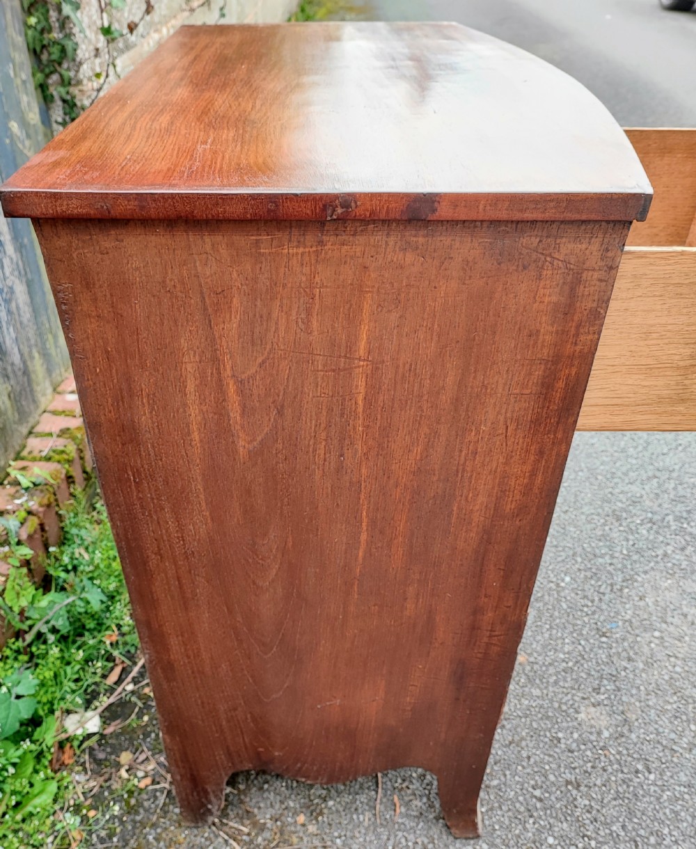A small Regency mahogany bowfront chest of drawers. View VI