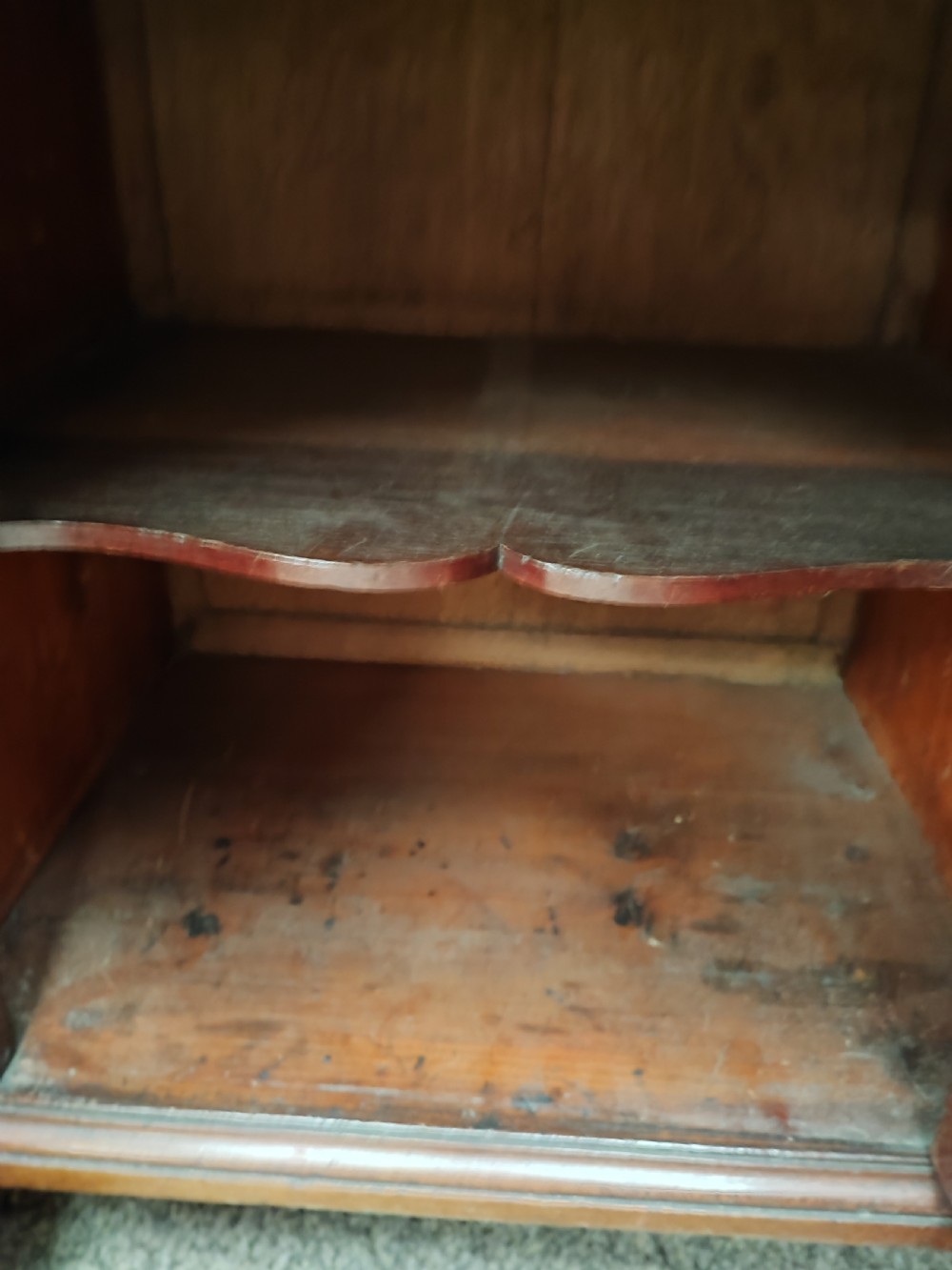 An eighteenth-century Georgian mahogany kneehole desk featuring a leather writing surface, multiple drawers with brass handles, a central recessed cupboard, and bracket feet. View II