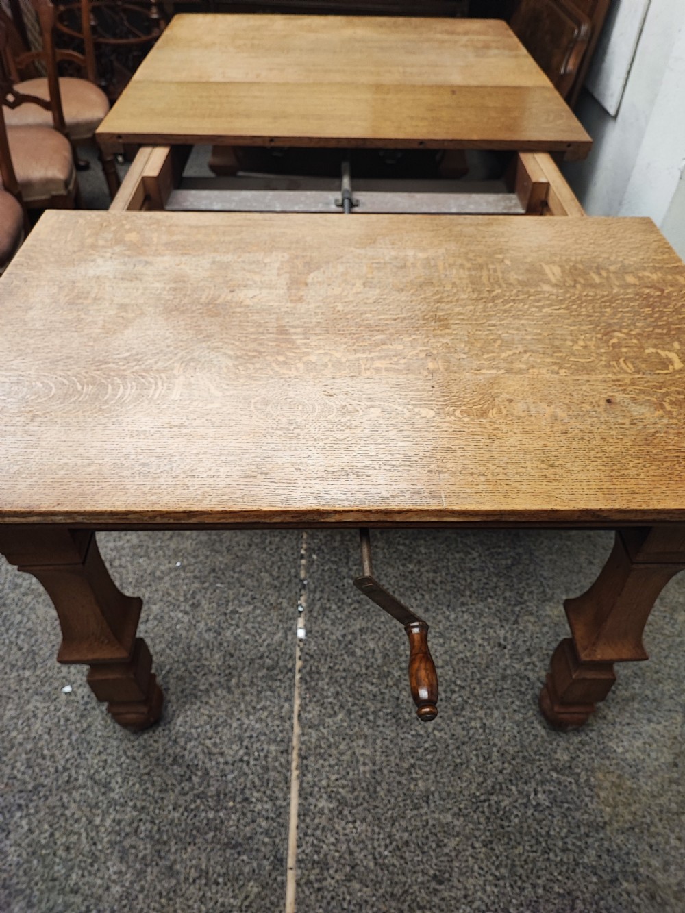 Antique golden oak 2 leaf extending dining table. View II