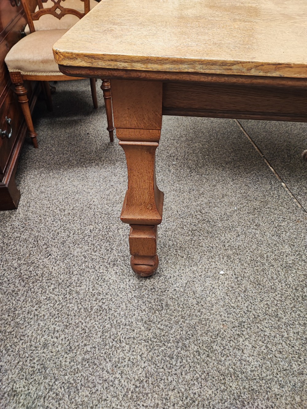 Antique golden oak 2 leaf extending dining table. View III