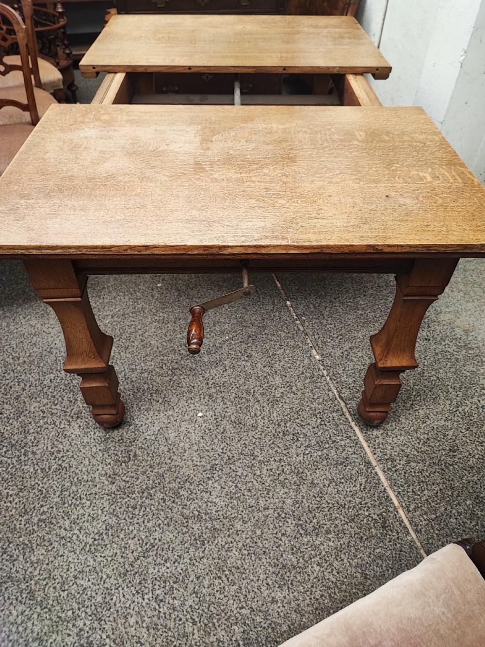 Antique golden oak 2 leaf extending dining table. View IV