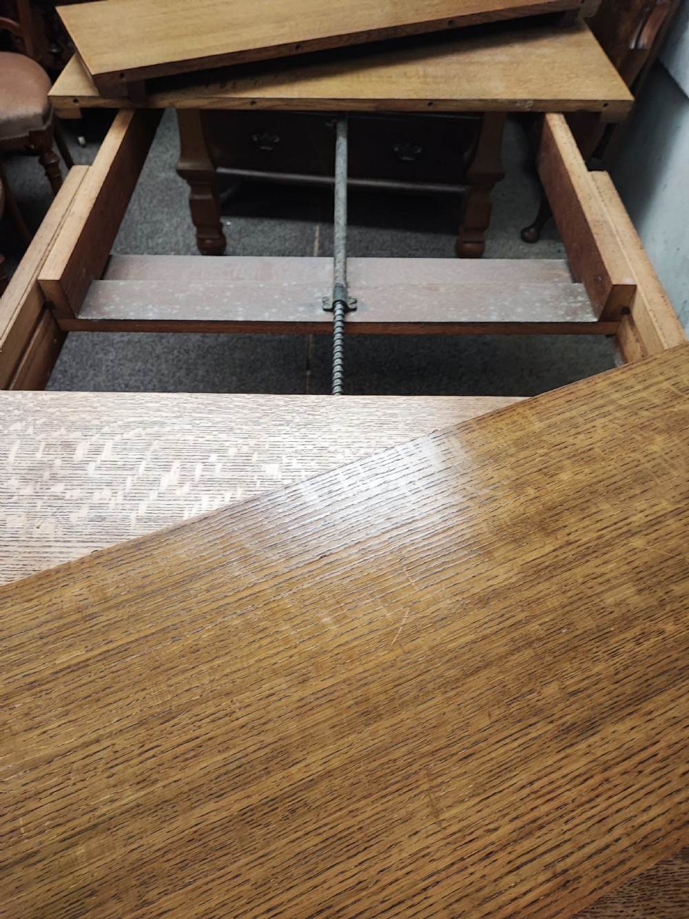 Antique golden oak 2 leaf extending dining table. View XI