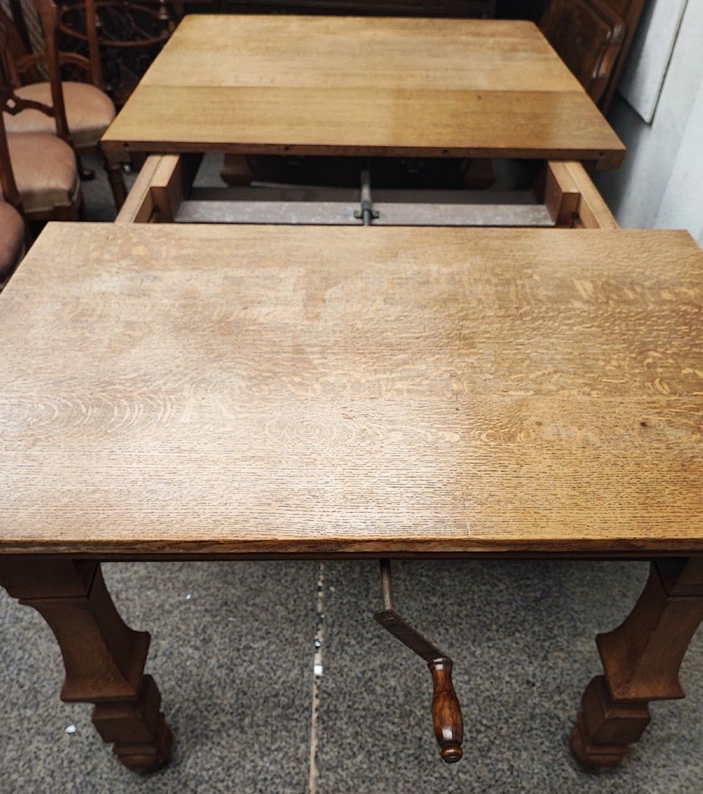 Antique golden oak 2 leaf extending dining table. View XVII
