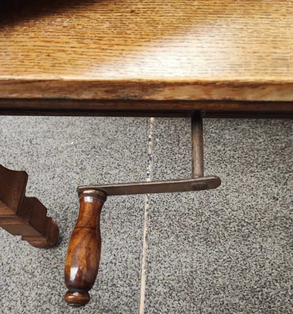 Antique golden oak 2 leaf extending dining table. View XXI