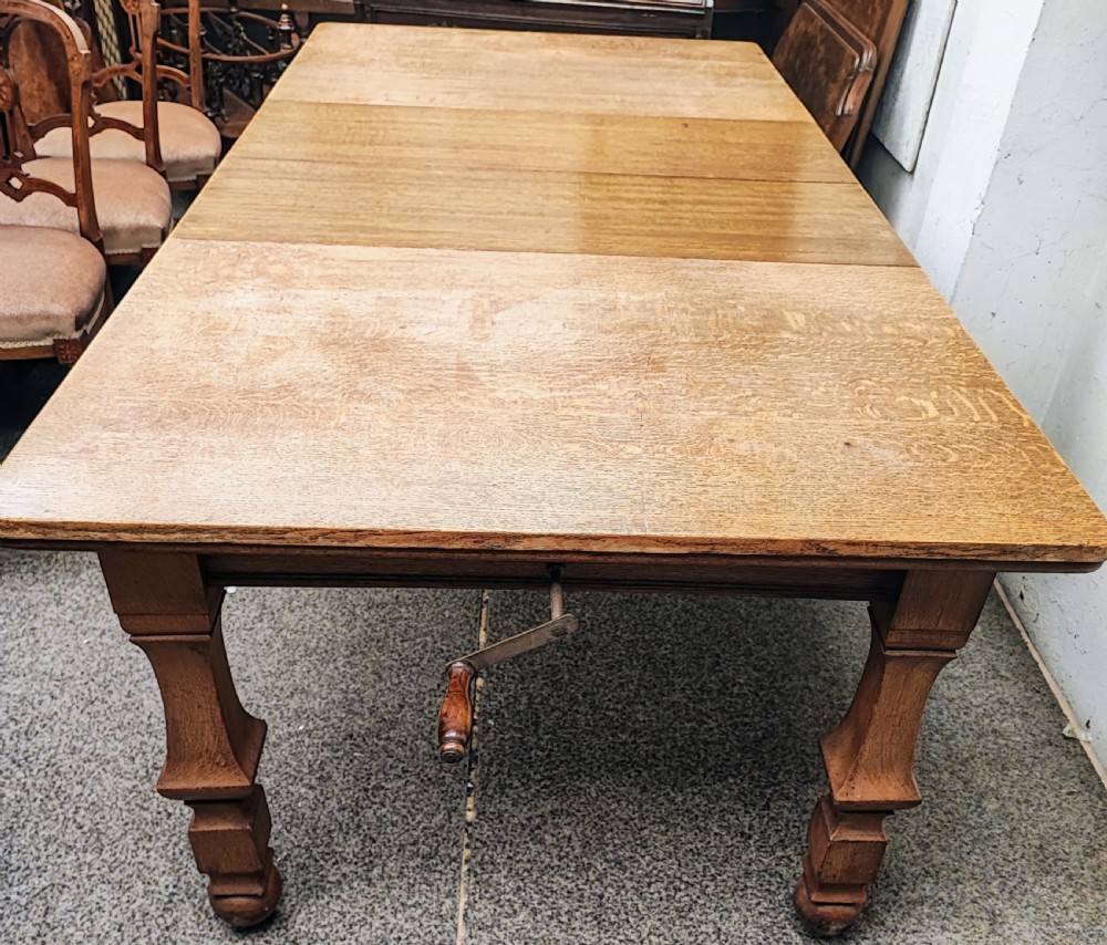 Antique golden oak 2 leaf extending dining table. View XXII