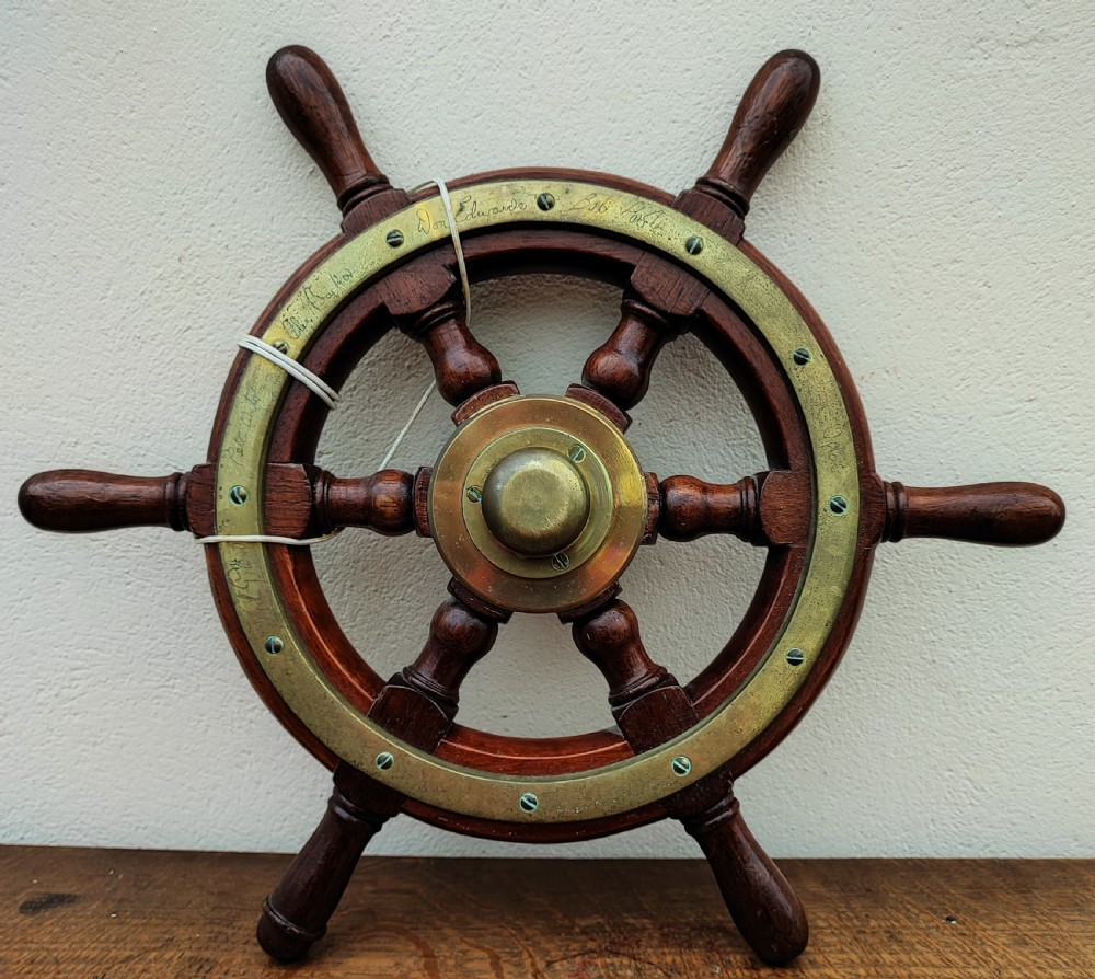 Antique ,teak and brass small ships wheel.