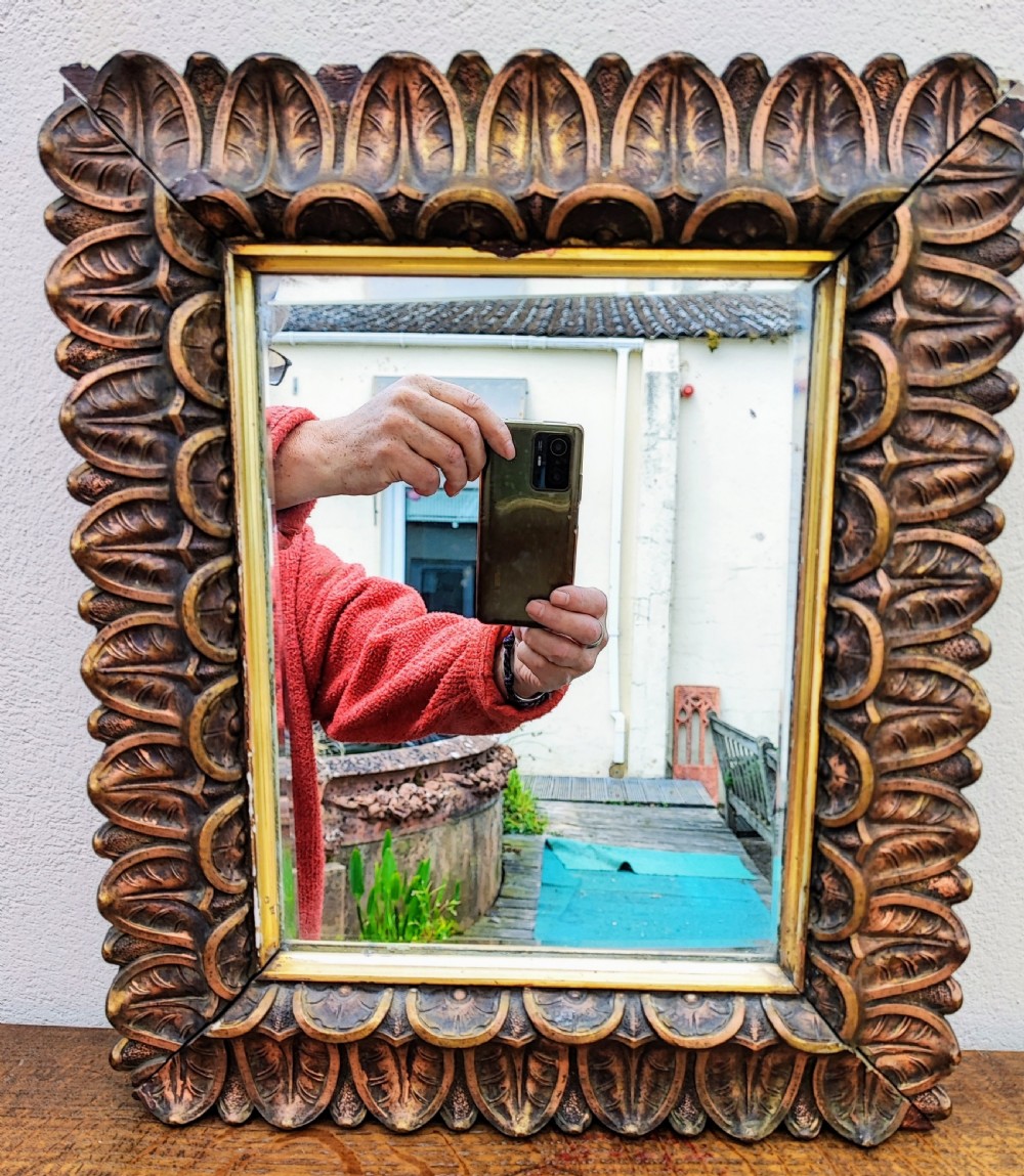 Antique carved and gessoed gilt mirror.