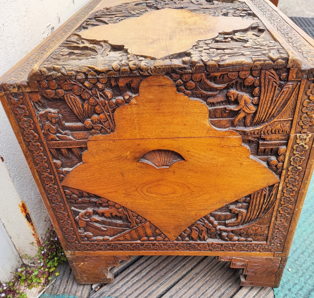 Striking antique carved teak and camphor trunk. View III