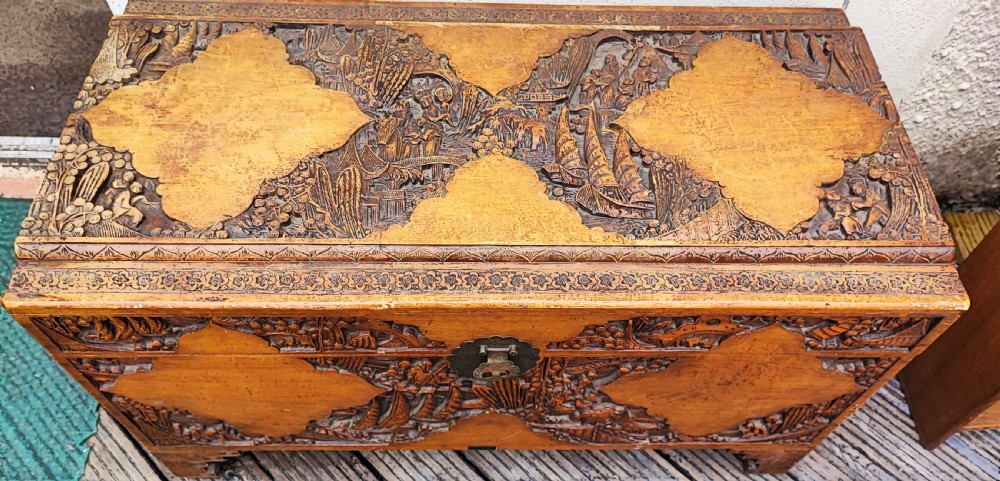 Striking antique carved teak and camphor trunk. View IV