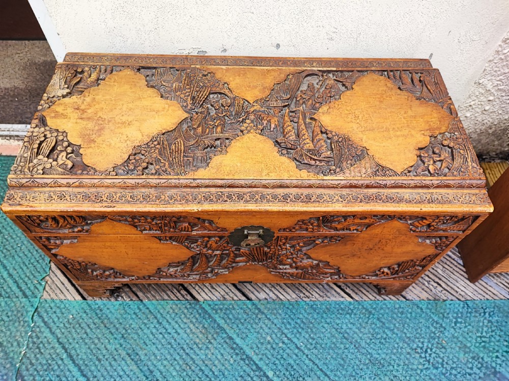 Striking antique carved teak and camphor trunk. View VIII