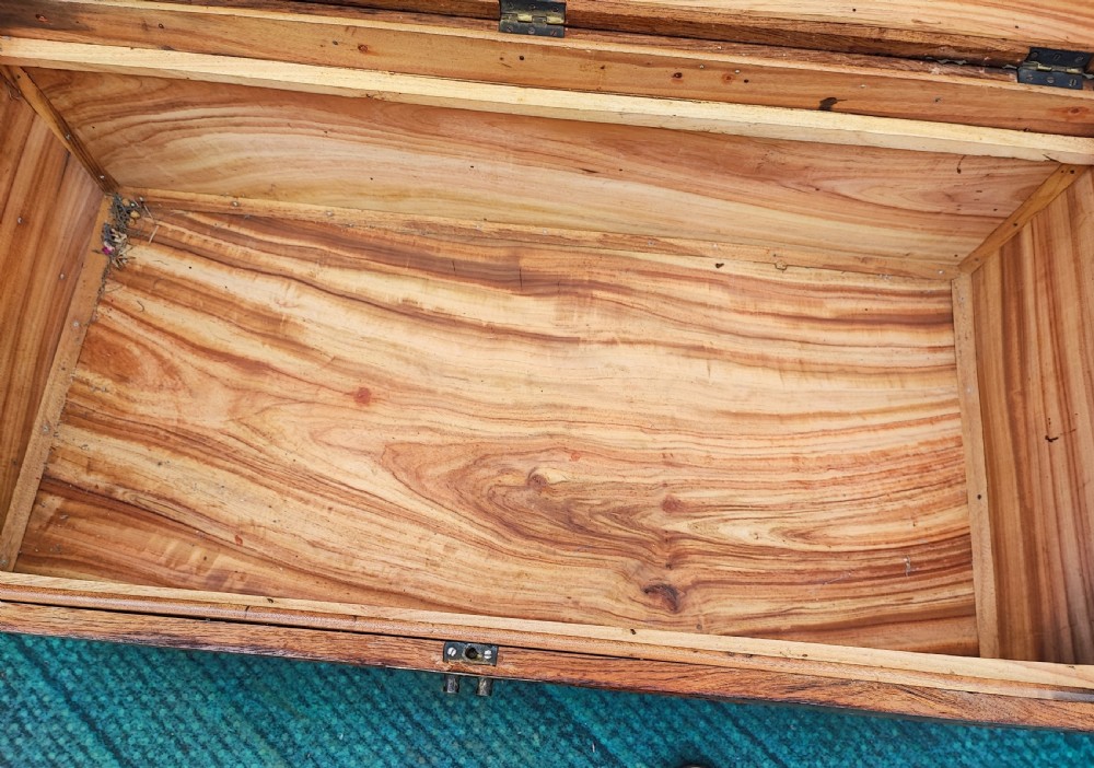 Striking antique carved teak and camphor trunk. View X